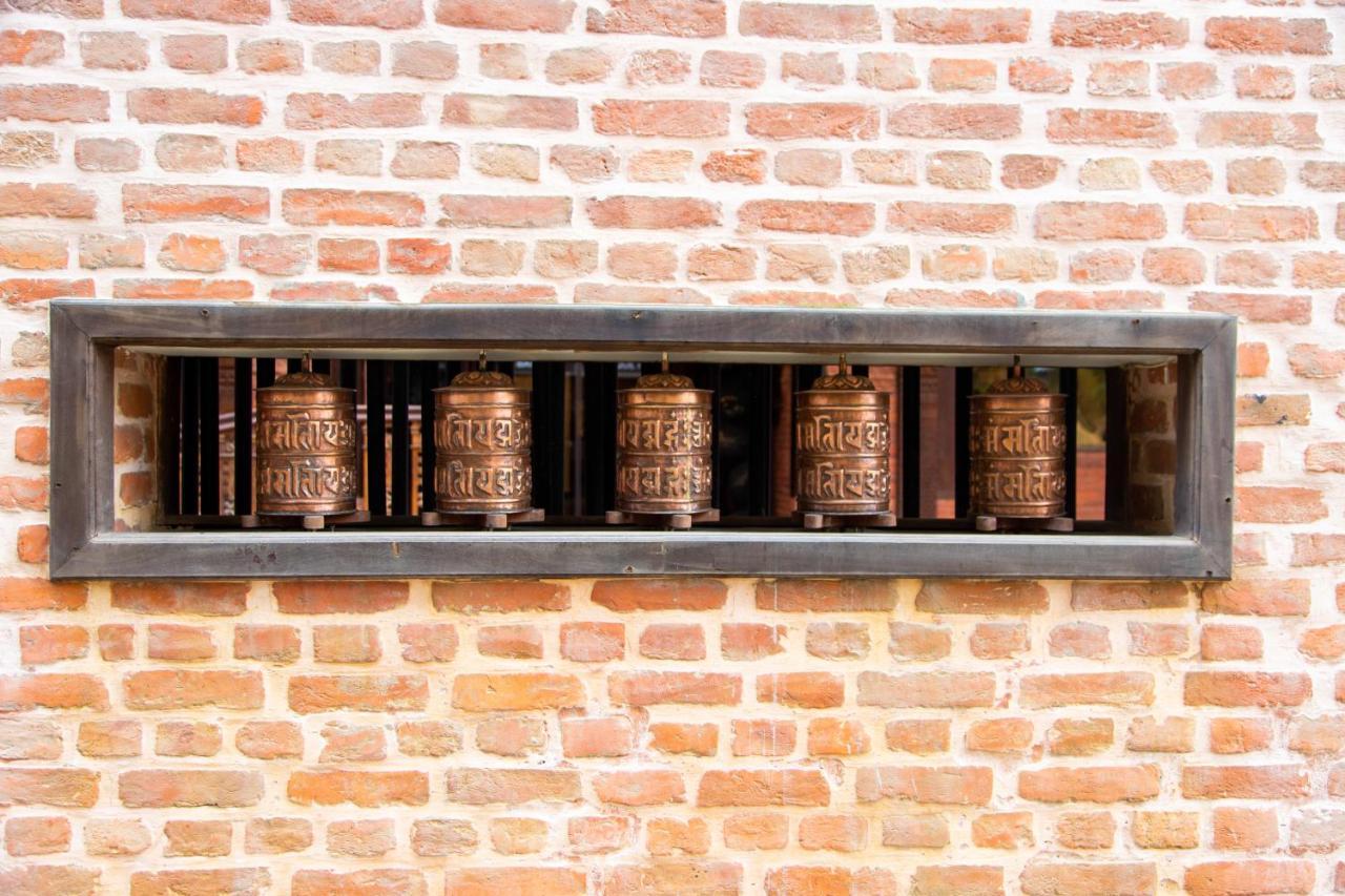 Basera Boutique Hotel Katmandú Exterior foto Prayer wheels at the temple